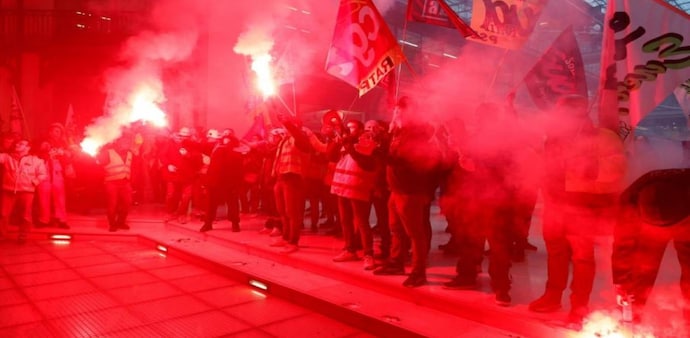French railway workers on strike demonstrate against BlackRock company inside an office building as part of the eleventh day of nationwide strikes and protests against French government's pension reform, in Paris (Reuters) French railway workers on strike demonstrate against BlackRock company inside an office building as part of the eleventh day of nationwide strikes and protests against French government's pension reform, in Paris (Reuters)