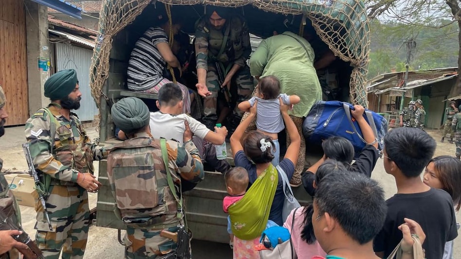 Army personnel rescue people from a violence-hit area of Manipur Army personnel rescue people from a violence-hit area of Manipur