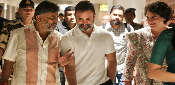 Congress leader Rahul Gandhi with party's General Secretary Priyanka Gandhi being welcomed by DK Shivakumar on their arrival to attend the swearing-in ceremony of the new Congress Government in Karnataka Congress leader Rahul Gandhi with party's General Secretary Priyanka Gandhi being welcomed by DK Shivakumar on their arrival to attend the swearing-in ceremony of the new Congress Government in Karnataka