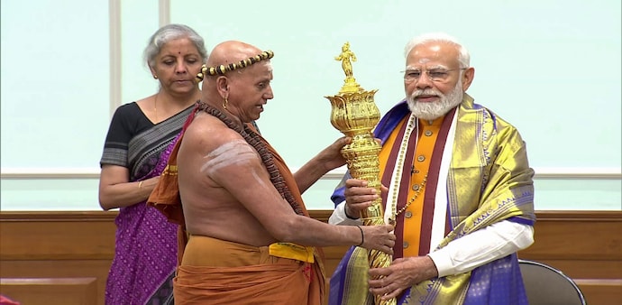 Prime Minister Narendra Modi receives 'Sengol' from an Adheenam on eve of new Parliament building inauguration Prime Minister Narendra Modi receives 'Sengol' from an Adheenam on eve of new Parliament building inauguration