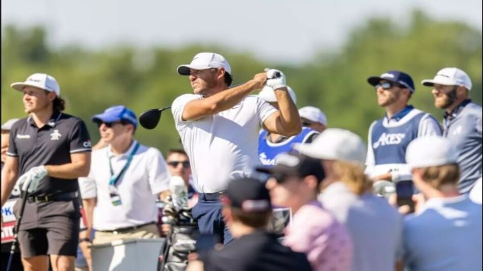 Smash GC captain and PGA champion Brooks Koepka in action at LIV Golf Washington in Friday with Rippers GC captain Cameron Smith (far left) looking on. Image courtesy livgolf.com. Smash GC captain and PGA champion Brooks Koepka in action at LIV Golf Washington in Friday with Rippers GC captain Cameron Smith (far left) looking on. Image courtesy livgolf.com.
