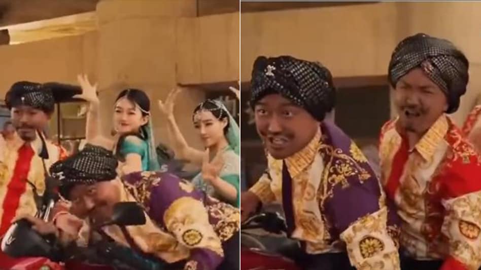 Two other Chinese men also wearing blackface join the comedian on the bike and invite three fair-skinned women. Two other Chinese men also wearing blackface join the comedian on the bike and invite three fair-skinned women.