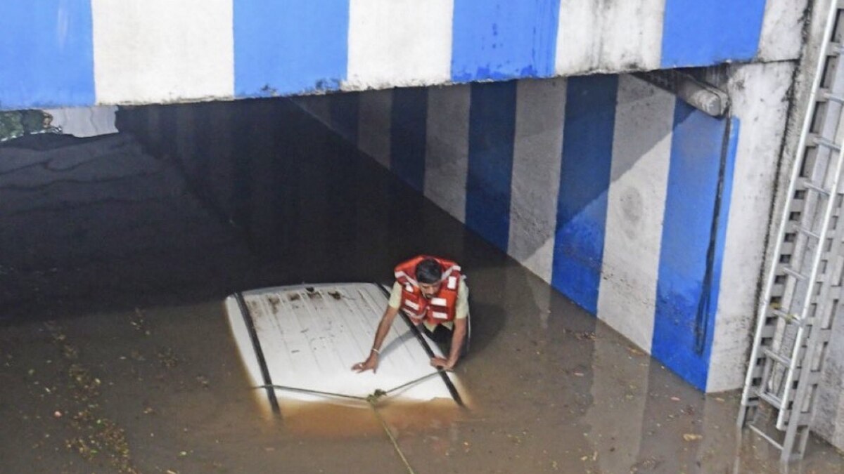 According to eyewitnesses, the driver of the car tried to zoom through the water but the car almost got submerged in the middle of the underpass. According to eyewitnesses, the driver of the car tried to zoom through the water but the car almost got submerged in the middle of the underpass.