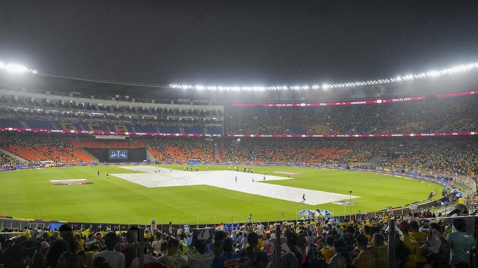 Covers placed on the pitch due to rain before the IPL 2023 cricket match between Gujarat Titans and Chennai Super Kings, at the Narendra Modi Stadium in Ahmedabad, Sunday, May 28 Covers placed on the pitch due to rain before the IPL 2023 cricket match between Gujarat Titans and Chennai Super Kings, at the Narendra Modi Stadium in Ahmedabad, Sunday, May 28