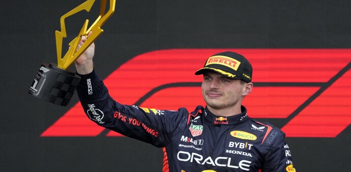 Formula One F1 - Canadian Grand Prix - Circuit Gilles Villeneuve, Montreal, Canada - June 18, 2023 Red Bull's Max Verstappen celebrates with a trophy on the podium after winning the race Formula One F1 - Canadian Grand Prix - Circuit Gilles Villeneuve, Montreal, Canada - June 18, 2023 Red Bull's Max Verstappen celebrates with a trophy on the podium after winning the race