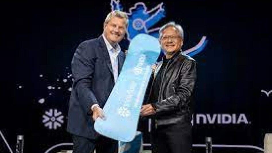 Snowflake Chairman and CEO Frank Slootman presents a snowboard as a gift to NVIDIA CEO Jensen Huang at Snowflake Summit 2023, in Las Vegas, Nevada, U.S. Snowflake Chairman and CEO Frank Slootman presents a snowboard as a gift to NVIDIA CEO Jensen Huang at Snowflake Summit 2023, in Las Vegas, Nevada, U.S.