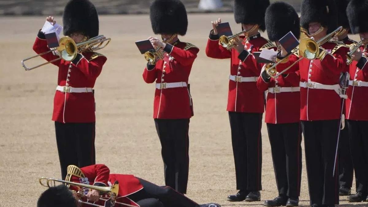 A trombonist who fainted, got up again in a bid to continue to play for the rehearsal. (Image: AP) A trombonist who fainted, got up again in a bid to continue to play for the rehearsal. (Image: AP)