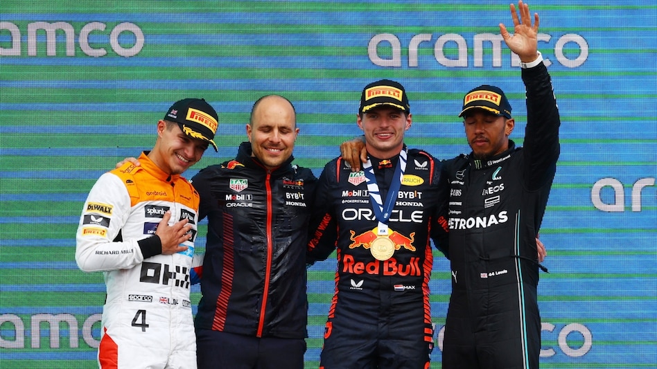 Red Bull's Max Verstappen celebrates on the podium after winning the race alongside second placed McLaren's Lando Norris and third placed Mercedes' Lewis Hamilton Red Bull's Max Verstappen celebrates on the podium after winning the race alongside second placed McLaren's Lando Norris and third placed Mercedes' Lewis Hamilton