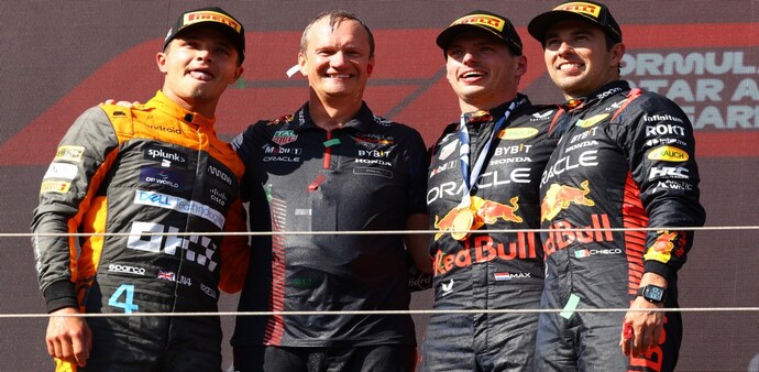 Formula One F1 - Hungarian Grand Prix - Red Bull's Max Verstappen celebrates on the podium after winning the Hungarian Grand Prix alongside second place McLaren's Lando Norris and third place Sergio Perez Formula One F1 - Hungarian Grand Prix - Red Bull's Max Verstappen celebrates on the podium after winning the Hungarian Grand Prix alongside second place McLaren's Lando Norris and third place Sergio Perez