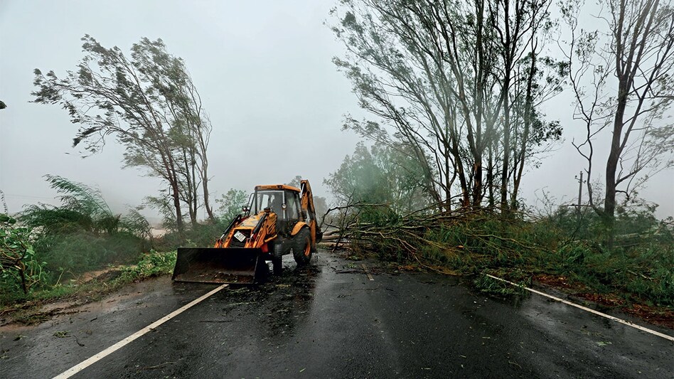 In the aftermath of Cyclone Biparjoy, a bulldozer removes fallen trees to clear a road in Kutch, Gujarat (Photo by GETTY IMAGES) In the aftermath of Cyclone Biparjoy, a bulldozer removes fallen trees to clear a road in Kutch, Gujarat (Photo by GETTY IMAGES)
