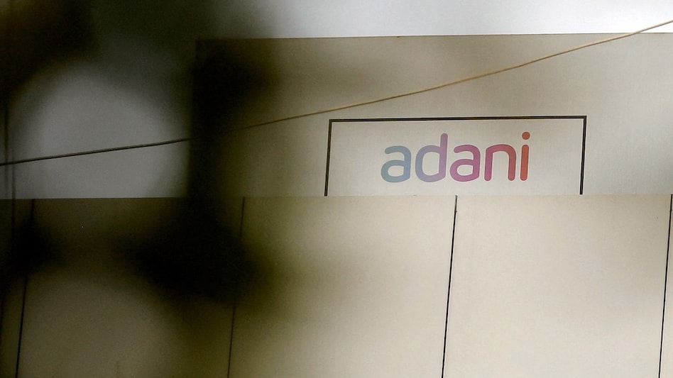 Adani promoters may pare more stake in group companies: Report Adani promoters may pare more stake in group companies: Report