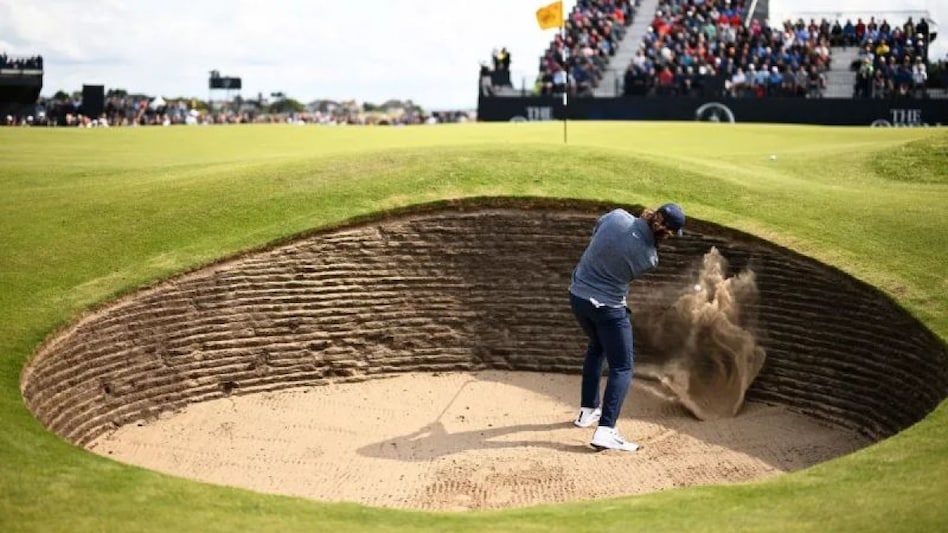 Local hero Tommy Fleetwood blasts out of the greenside bunker on hole six of Royal Liverpool Golf Club on day two of the 151st Open at Hoylake (Source: theopen.com) Local hero Tommy Fleetwood blasts out of the greenside bunker on hole six of Royal Liverpool Golf Club on day two of the 151st Open at Hoylake (Source: theopen.com)