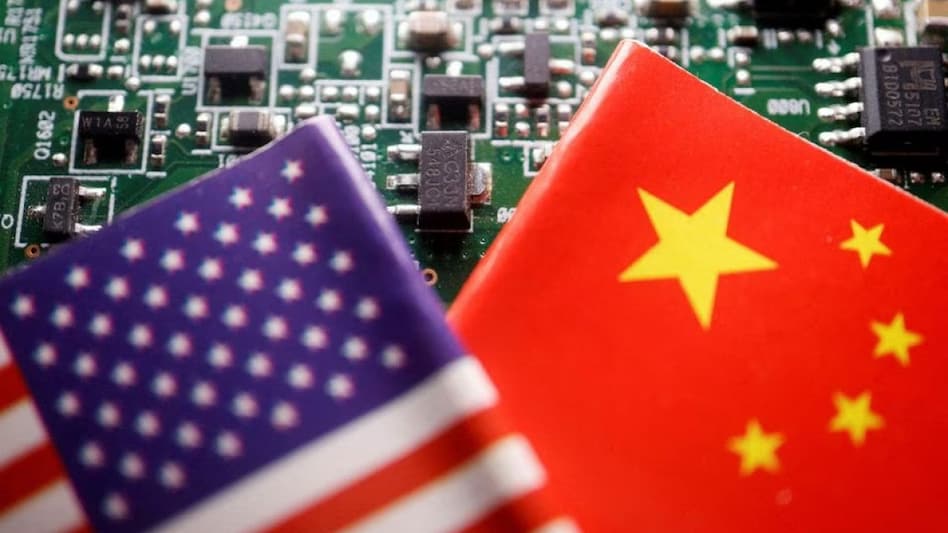 Flags of China and U.S. are displayed on a printed circuit board with semiconductor chips Flags of China and U.S. are displayed on a printed circuit board with semiconductor chips