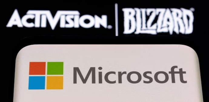Microsoft logo is seen on a smartphone placed on displayed Activision Blizzard logo Microsoft logo is seen on a smartphone placed on displayed Activision Blizzard logo
