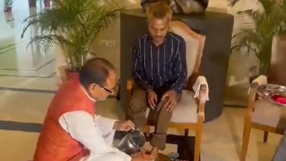 After the video went viral, MP CM Shivraj Singh Chouhan on Thursday washed the feet of Rawat and apologised to him. After the video went viral, MP CM Shivraj Singh Chouhan on Thursday washed the feet of Rawat and apologised to him.