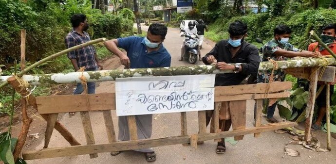 A sign reading "Nipah containment zone" placed on a barricade in Kozhikode on September 13. A sign reading "Nipah containment zone" placed on a barricade in Kozhikode on September 13.