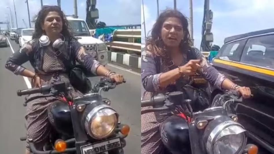 The woman was stopped by the police for riding without a helmet The woman was stopped by the police for riding without a helmet