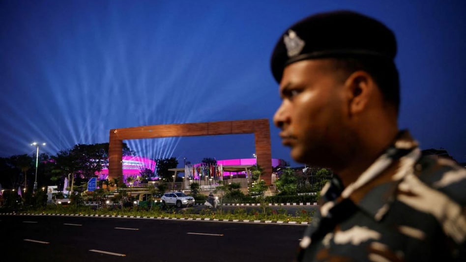 A security officer stands guard in front of 'Bharat Mandapam' ahead of the G20 Summit in New Delhi. A security officer stands guard in front of 'Bharat Mandapam' ahead of the G20 Summit in New Delhi.