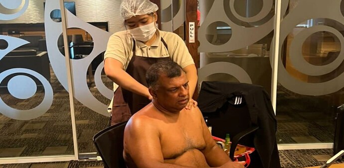 Tony Fernandes posted a photo of himself sitting shirtless inside a conference room on LinkedIn Tony Fernandes posted a photo of himself sitting shirtless inside a conference room on LinkedIn