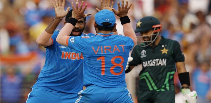 Cricket - ICC Cricket World Cup 2023 - India v Pakistan - Narendra Modi Stadium, Ahmedabad, India - October 14, 2023 India's Jasprit Bumrah celebrates with Virat Kohli after taking the wicket of Pakistan's Mohammad Rizwan Cricket - ICC Cricket World Cup 2023 - India v Pakistan - Narendra Modi Stadium, Ahmedabad, India - October 14, 2023 India's Jasprit Bumrah celebrates with Virat Kohli after taking the wicket of Pakistan's Mohammad Rizwan