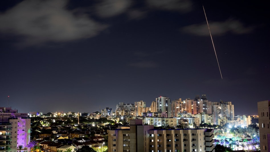 A view shows a rocket being launched from the Gaza Strip towards central Israel, as seen from Ashkelon in southern Israel. (REUTERS/Amir Cohen) A view shows a rocket being launched from the Gaza Strip towards central Israel, as seen from Ashkelon in southern Israel. (REUTERS/Amir Cohen)