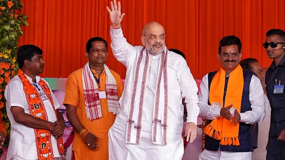 Union Home Minister Amit Shah with Madhya Pradesh BJP President V.D. Sharma during a public meeting ahead of MP Assembly elections, at Junnardeo in Chhindwara district. (PTI Photo) Union Home Minister Amit Shah with Madhya Pradesh BJP President V.D. Sharma during a public meeting ahead of MP Assembly elections, at Junnardeo in Chhindwara district. (PTI Photo)