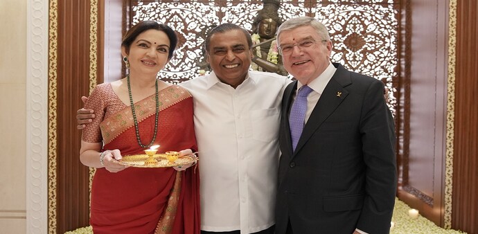Nita and Mukesh Ambani with IOC President Thomas Bach Nita and Mukesh Ambani with IOC President Thomas Bach