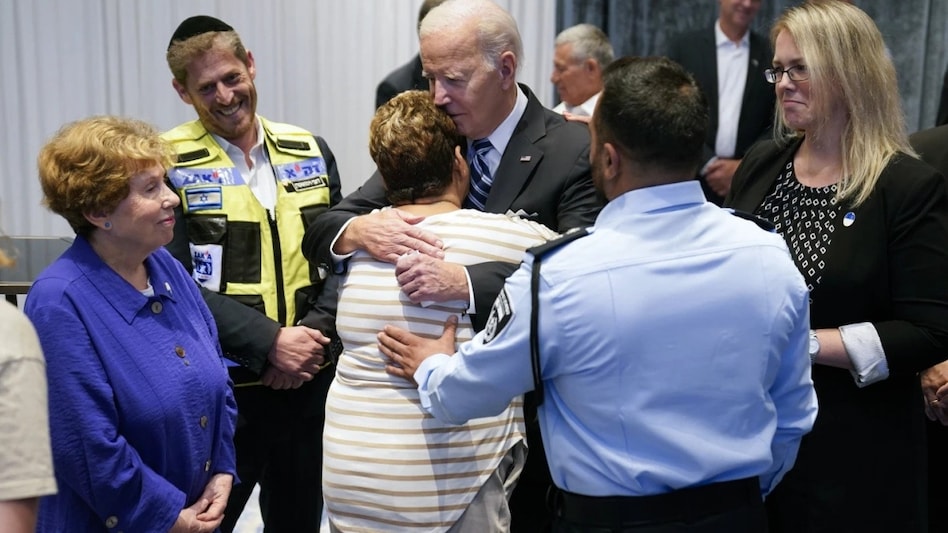 Upon meeting Biden, the woman hugged him as the POTUS thanked her for defending the country. Upon meeting Biden, the woman hugged him as the POTUS thanked her for defending the country.