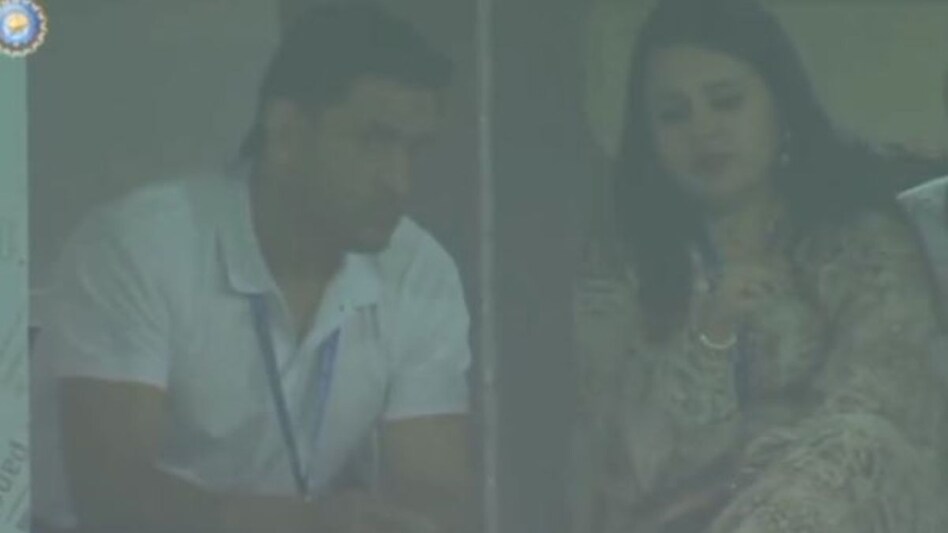 Former Indian captain Mahendra Singh Dhoni was spotted watching the India vs England World Cup match from the stands with his wife Sakshi on Sunday Former Indian captain Mahendra Singh Dhoni was spotted watching the India vs England World Cup match from the stands with his wife Sakshi on Sunday