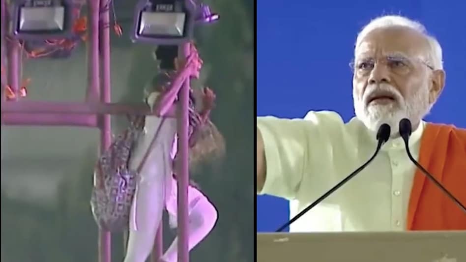 PM Modi urges woman who climbed up a pole to come down during Telangana rally PM Modi urges woman who climbed up a pole to come down during Telangana rally