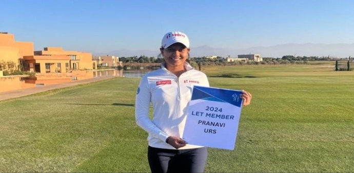Mysore golfer Pranavi Urs with the placard declaring her Ladies European Tour status in Marrakech, Morocco. Image courtesy X. Mysore golfer Pranavi Urs with the placard declaring her Ladies European Tour status in Marrakech, Morocco. Image courtesy X.