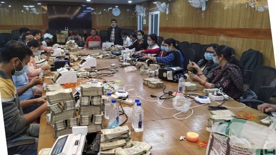 Besides Rs 351 crore cash, the tax sleuths have also recovered approximately 3 kg of gold ornaments. Besides Rs 351 crore cash, the tax sleuths have also recovered approximately 3 kg of gold ornaments.