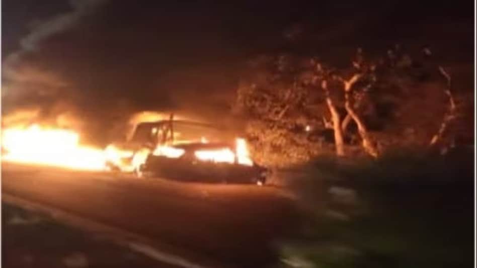 The crash was followed by a loud explosion as the two vehicles went up in flames The crash was followed by a loud explosion as the two vehicles went up in flames
