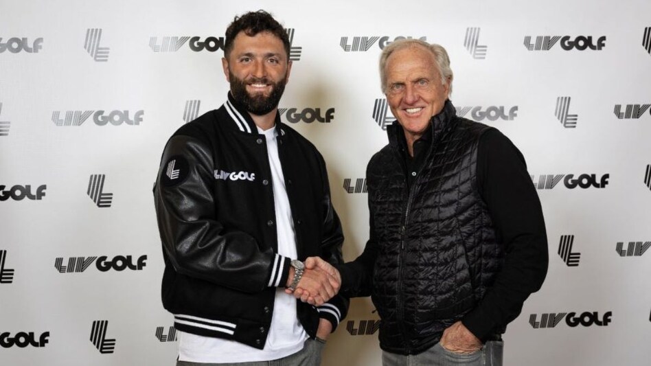 Jon Rahm shakes hands with LIV Golf commissioner and chief executive Greg Norman after his joining the parallel league was formally announced on Thursday. Image courtesy X. Jon Rahm shakes hands with LIV Golf commissioner and chief executive Greg Norman after his joining the parallel league was formally announced on Thursday. Image courtesy X.