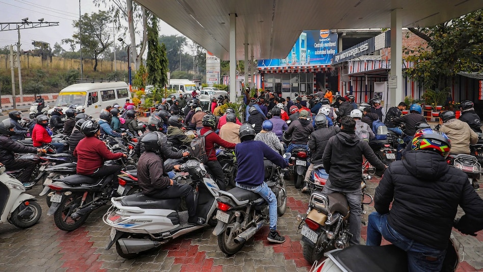Heavy rush at a petrol pump following the nationwide strike of truck drivers against a provision in the new penal law on hit-and-run accident cases, in Jammu, Tuesday (PTI) Heavy rush at a petrol pump following the nationwide strike of truck drivers against a provision in the new penal law on hit-and-run accident cases, in Jammu, Tuesday (PTI)