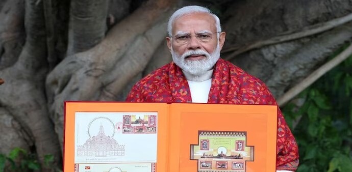 Prime Minister Narendra Modi with the stamp book on Thursday. Prime Minister Narendra Modi with the stamp book on Thursday.