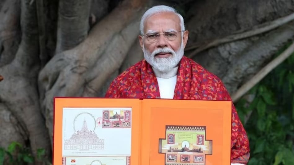 Prime Minister Narendra Modi with the stamp book on Thursday. Prime Minister Narendra Modi with the stamp book on Thursday.
