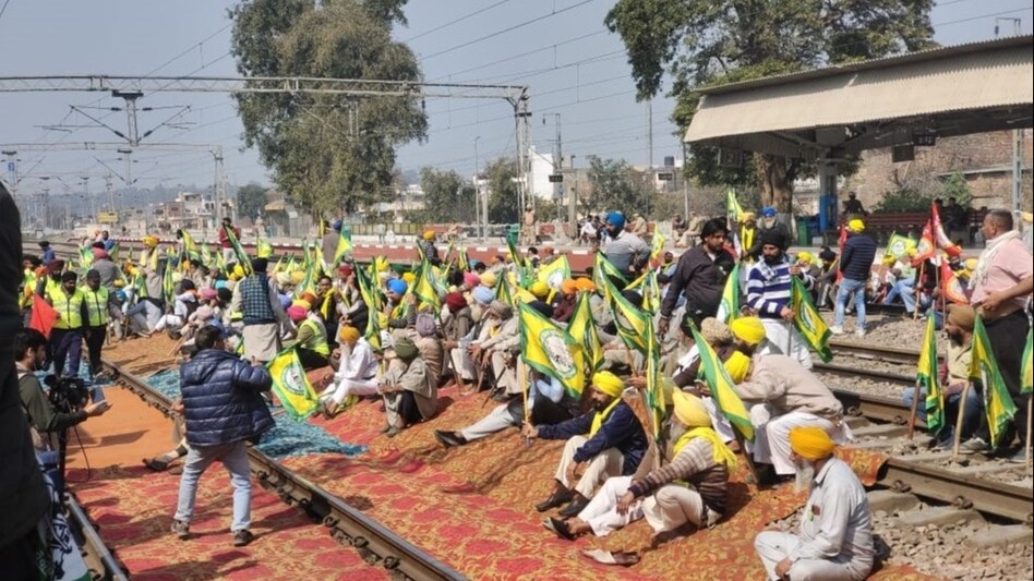 Farmers protest: Protesting farmers sit on train tracks Farmers protest: Protesting farmers sit on train tracks