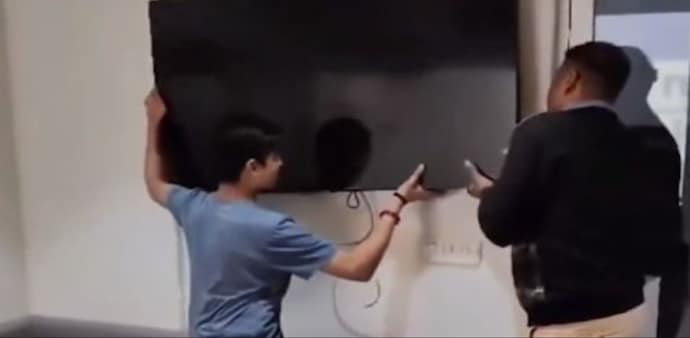 A video uploaded on Instagram documented the audacious act, depicting a father and son disassembling the television set as the mother observed. A video uploaded on Instagram documented the audacious act, depicting a father and son disassembling the television set as the mother observed.