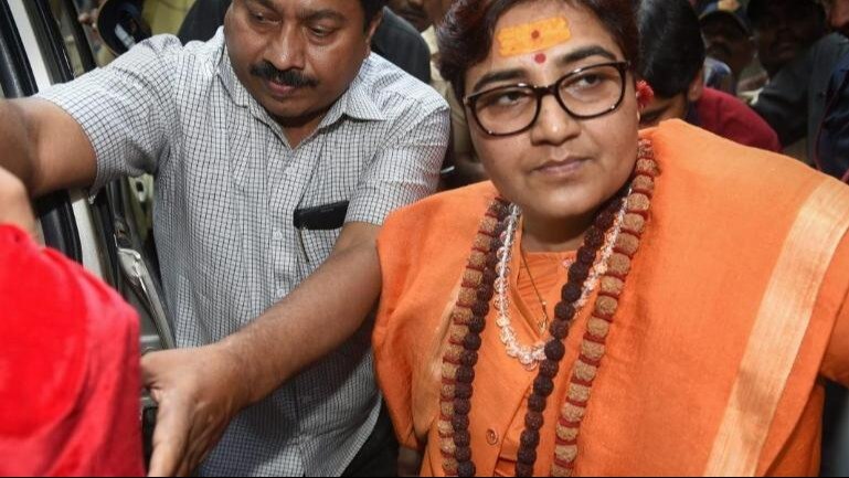 Her tenure as an MP has been marked by controversies, including her comments on late ATS chief Hemant Karkare and the 'Godse' remark in Parliament Her tenure as an MP has been marked by controversies, including her comments on late ATS chief Hemant Karkare and the 'Godse' remark in Parliament