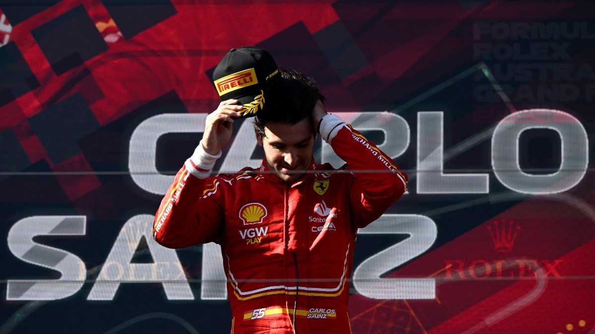 Ferrari's Carlos Sainz Jr. celebrates on the podium after winning the Australian Grand Prix Ferrari's Carlos Sainz Jr. celebrates on the podium after winning the Australian Grand Prix