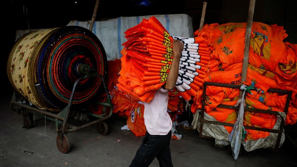 Garment makers are temporarily converting factories where they usually make saris into production hubs for election flags and banners. Garment makers are temporarily converting factories where they usually make saris into production hubs for election flags and banners.