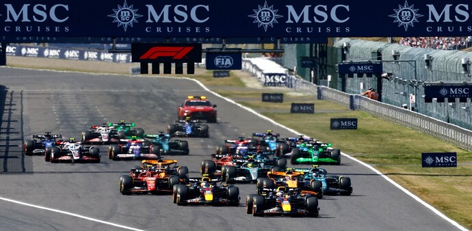 Formula One F1 - Japanese Grand Prix - Suzuka Circuit, Suzuka, Japan - April 7, 2024 Red Bull's Max Verstappen, Sergio Perez and drivers are seen on the first corner at the start of the race REUTERS/Issei Kato Formula One F1 - Japanese Grand Prix - Suzuka Circuit, Suzuka, Japan - April 7, 2024 Red Bull's Max Verstappen, Sergio Perez and drivers are seen on the first corner at the start of the race REUTERS/Issei Kato