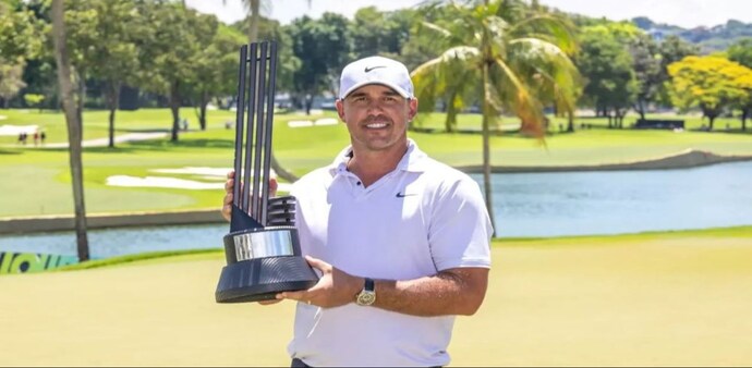 Brooks Koepka with his trophy on the podium in Singapore on Sunday. Image courtesy livgolf.com. Brooks Koepka with his trophy on the podium in Singapore on Sunday. Image courtesy livgolf.com.