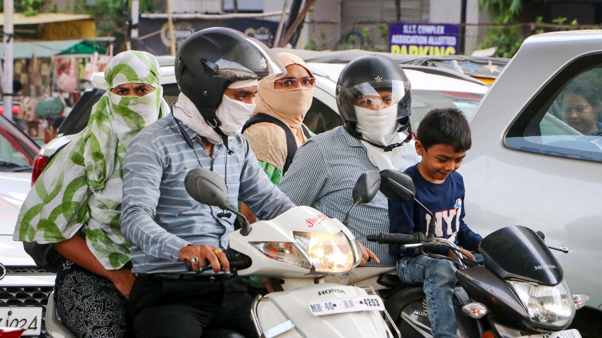 Commuters cover themselves for protection from the scorching sun on a hot summer day in Nagpur. (Photo: PTI) Commuters cover themselves for protection from the scorching sun on a hot summer day in Nagpur. (Photo: PTI)