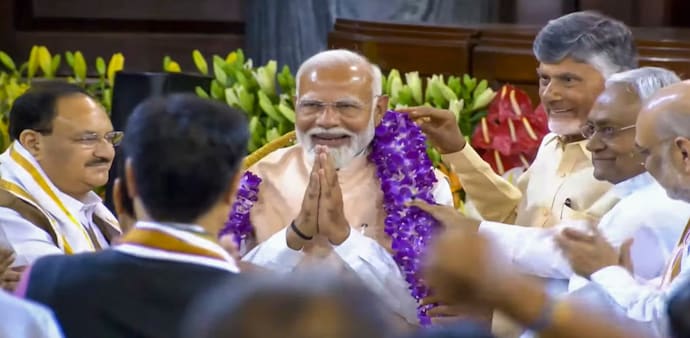 PM-elect Narendra Modi with other elected MPs supporting the NDA on Friday. PM-elect Narendra Modi with other elected MPs supporting the NDA on Friday.