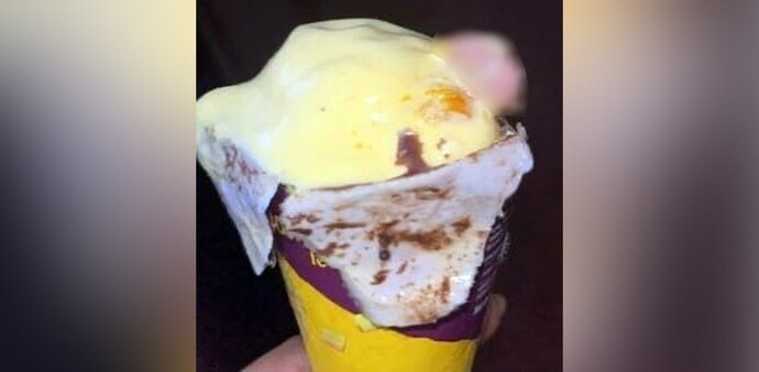 Finger in ice cream Finger in ice cream
