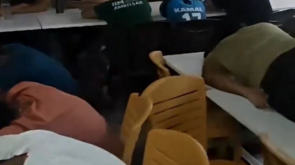 The now-viral video of the protest shows students sleeping on canteen chairs, with one even lying on a table. The now-viral video of the protest shows students sleeping on canteen chairs, with one even lying on a table.