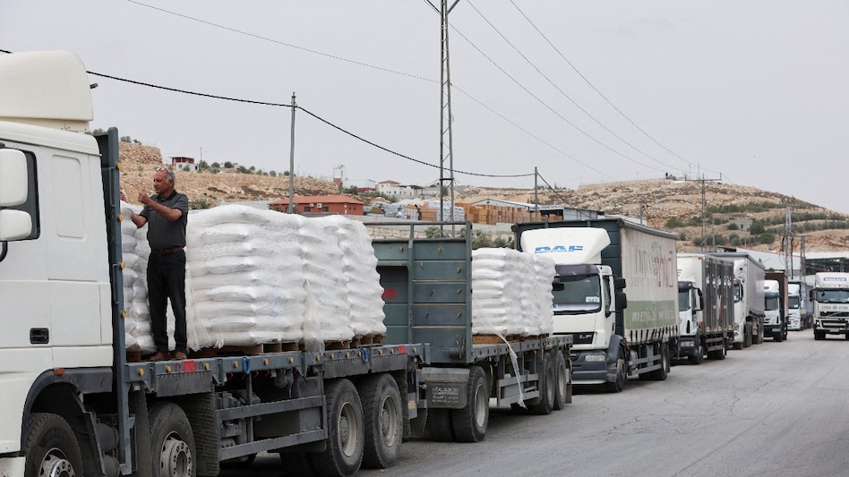 Commercial food trucks are seen near a checkpoint near Hebron, amid the ongoing conflict in Gaza between Israel and the Palestinian Islamist group Hamas, in the Israeli-occupied West Bank. (Picture: Reuters) Commercial food trucks are seen near a checkpoint near Hebron, amid the ongoing conflict in Gaza between Israel and the Palestinian Islamist group Hamas, in the Israeli-occupied West Bank. (Picture: Reuters)