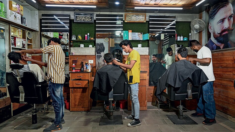 Barbers employed at a small shop in Faridabad, Haryana (Photo: Arun Kumar) Barbers employed at a small shop in Faridabad, Haryana (Photo: Arun Kumar)